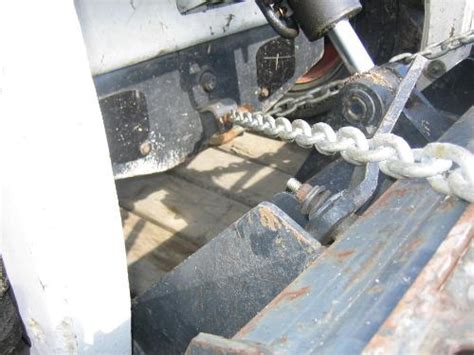 skidsteer bobcat chain to trailer